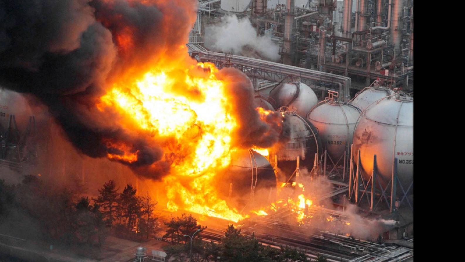A picture containing text, fire, car bomb, transport

Description automatically generated